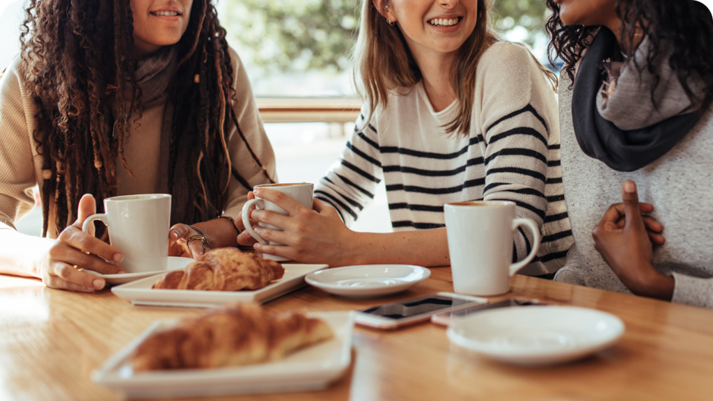 3 women talking during meal 