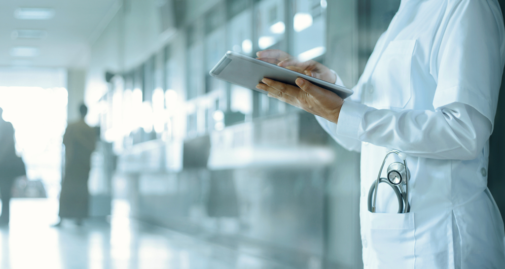 Doctor using a tablet inside a hospital