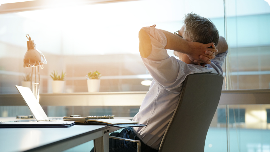 man stretching inside an office