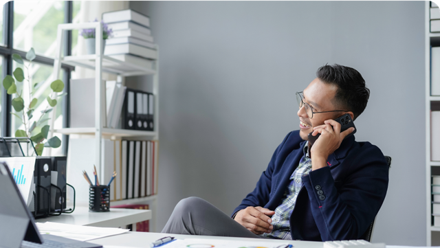 man talking on mobile phone in office