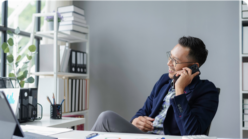 man talking on mobile phone in office