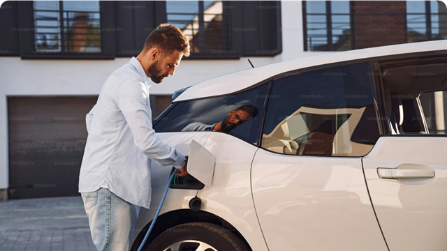 Person charging an Electric vehicle