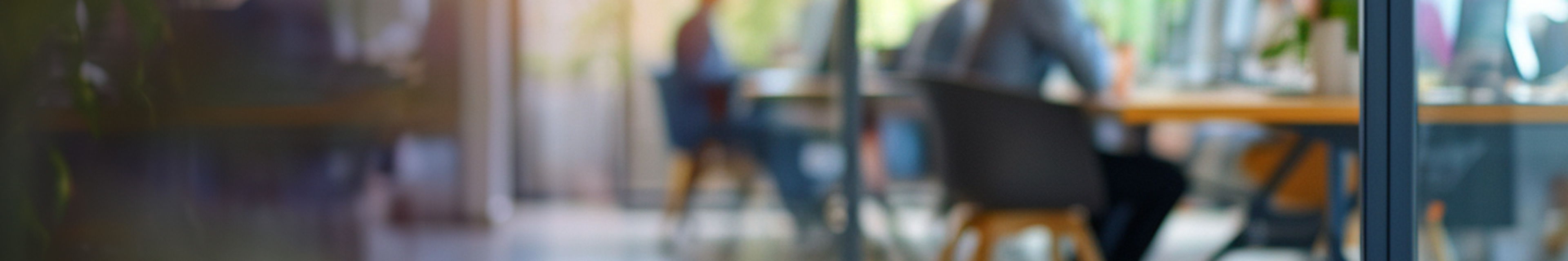 a blur background image of an office meeting