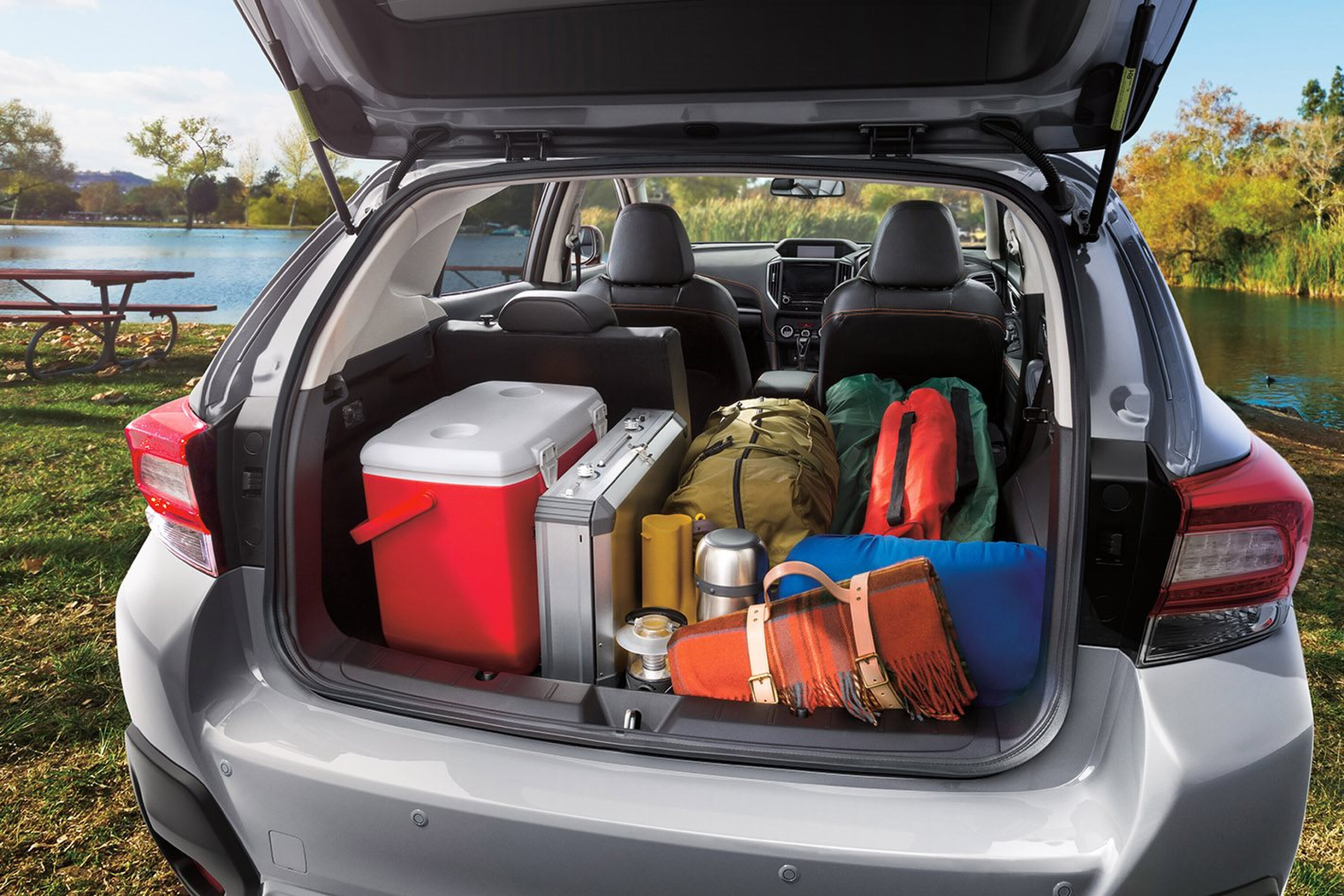 A car rear view showing a full boot of travel bags