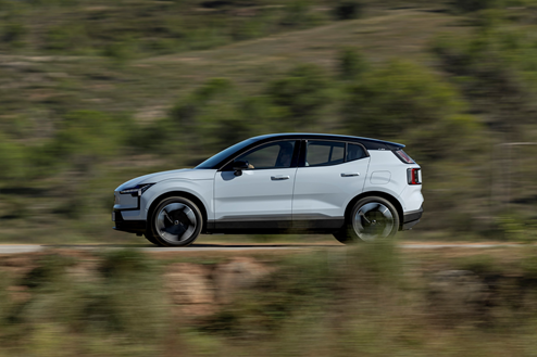 Volvo EX30 in motion on country road