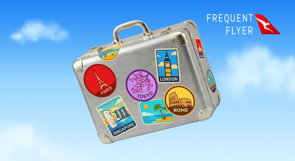 Suitcase with travel destination stickers representing a frequent flyer rewards program