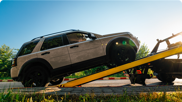 A car being towed off the road