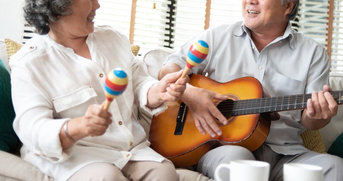 Senior couple with guitar and maracas